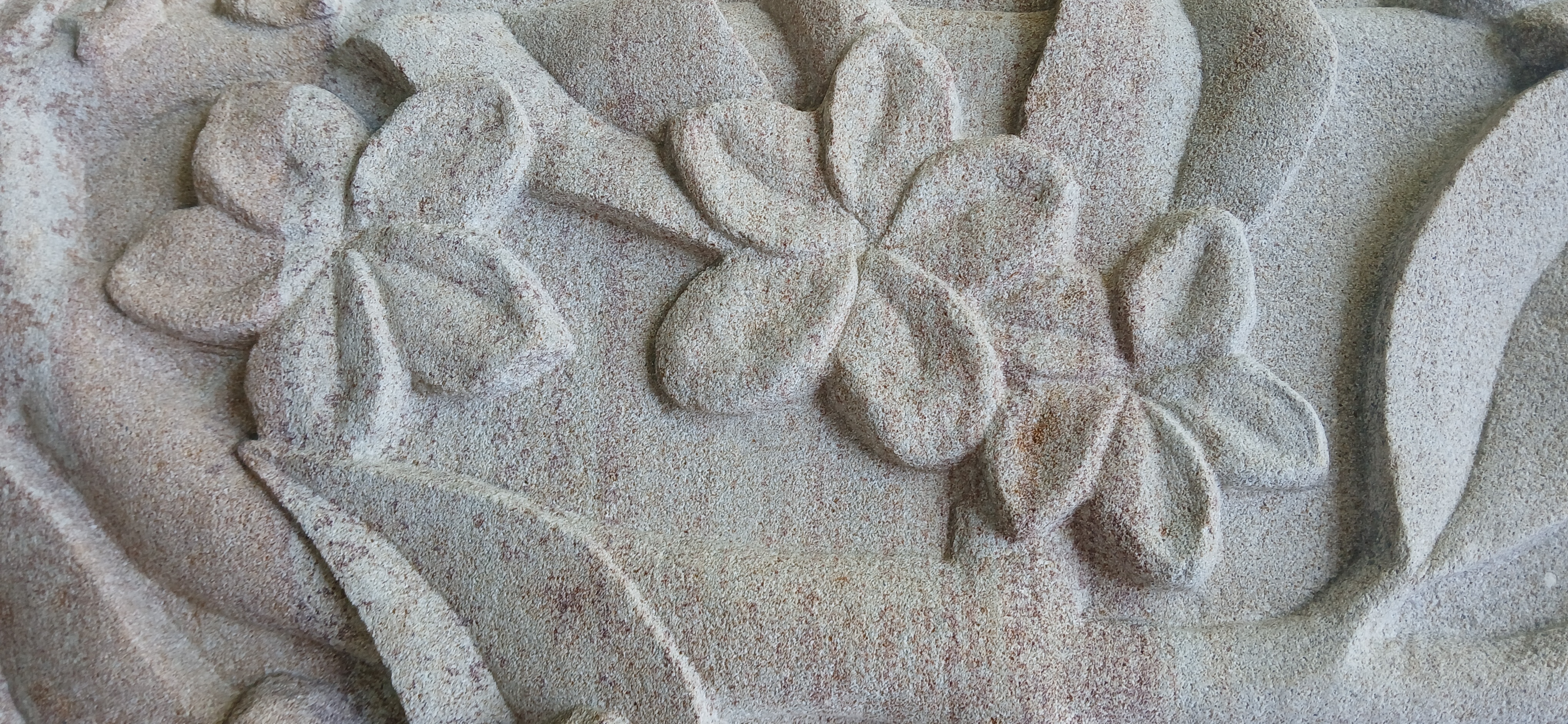 Detailed floral carving in sandstone