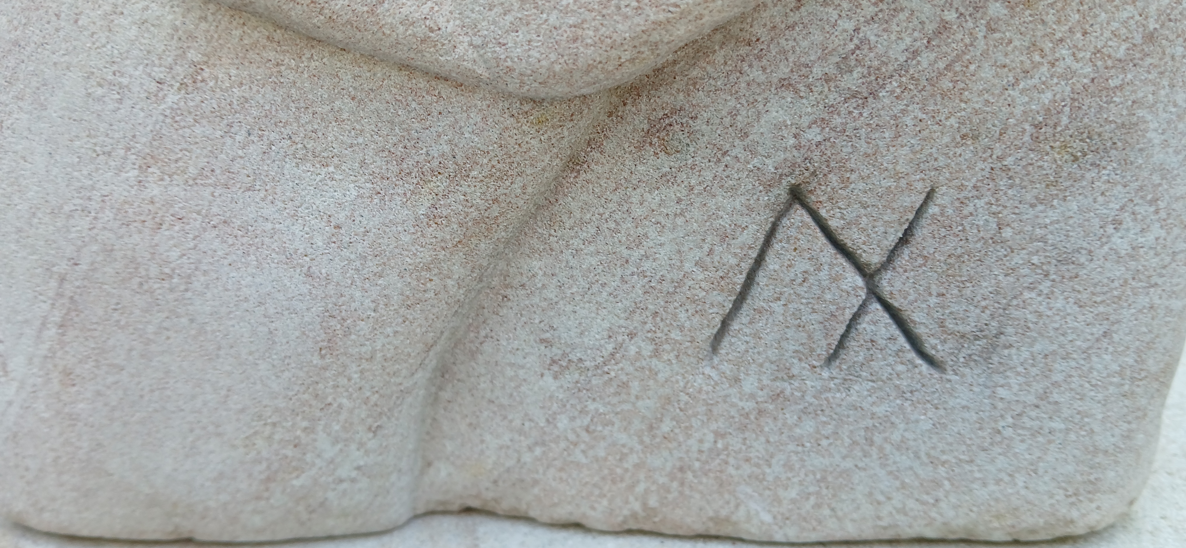 Carved Ax signature in stone